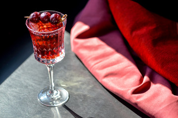 alcohol cherry cocktail in a glass
