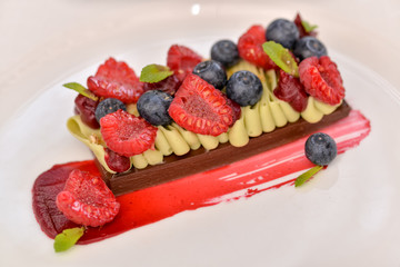dessert cake with berries in a plate