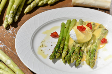 vegan menu egg plow with asparagus decorated with dried tomatoes
