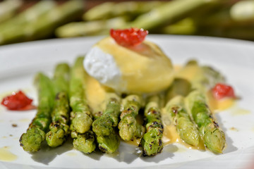 vegan menu egg plow with asparagus decorated with dried tomatoes