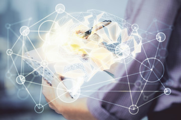 Multi exposure of woman's writing hand on background with brain hologram. Concept of brainstorming.