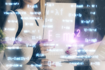 Science formula hologram over woman's hands taking notes background. Concept of study. Multi exposure