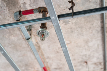 old style fire sprinkler is ready to replace - obrazy, fototapety, plakaty