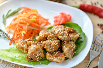 teriyaki chicken with vegetable salad on a plate