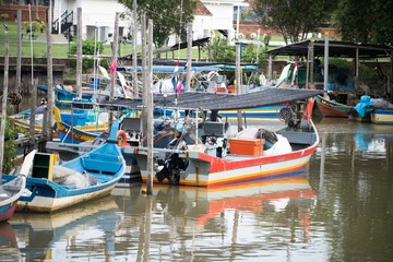 Fototapeta na wymiar wooden fish boat parking at the pier