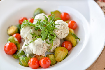  chicken meatballs with jam in a white round plate