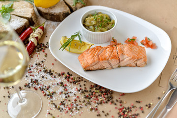 dish menu salmon with lemon and sauce