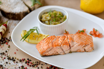 dish menu salmon with lemon and sauce