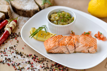 dish menu salmon with lemon and sauce