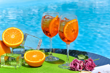 two summer cocktails near the water pool