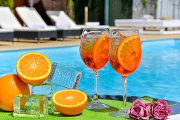 two summer cocktails near the water pool