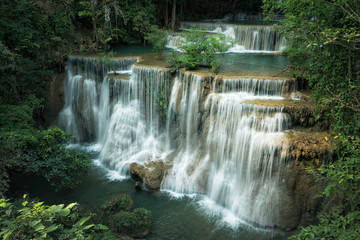 Fototapeta na wymiar Huay Maekamin Waterfall Tier 4 (Chatkaew) in Kanchanaburi, Thailand; photo by long exposure with slow speed shutter