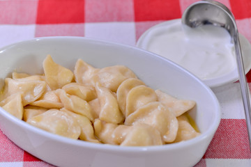 boiled dumplings with sour cream