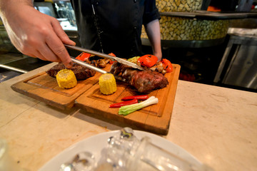 man cutting vegetables in kitchen