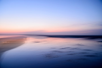 Fototapeta na wymiar Beautiful evening sunset scenery on wetland seacoast