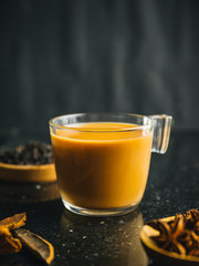Chai tea latte on dark background