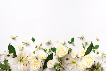 Spring composition of rose flowers on white background with copy space. Creative layout. Flat lay....