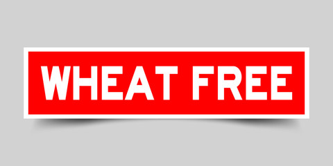 Square red sticker label in word wheat free on gray background