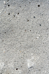Closeup macro view of rough gray color stone surface. Detailed nature background or pattern texture taken in natural environment. Weathered many years, inimitable and unique effect to textured design