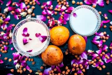Sapodilla pulp well mixed with raw milk in a glass bowl on wooden surface for the bulging on the hands.