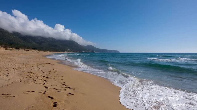 Sea waves at San Nicolo’s beach, Sardinia, Italy