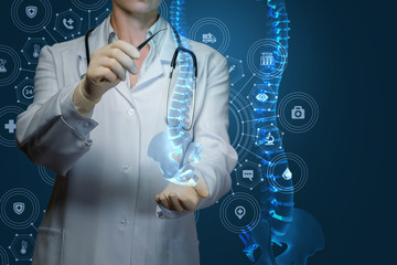 Worker of medicine treats the human spine . - obrazy, fototapety, plakaty