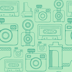 Retro cameras and audio cassettes hand drawn line art style seamless pattern.