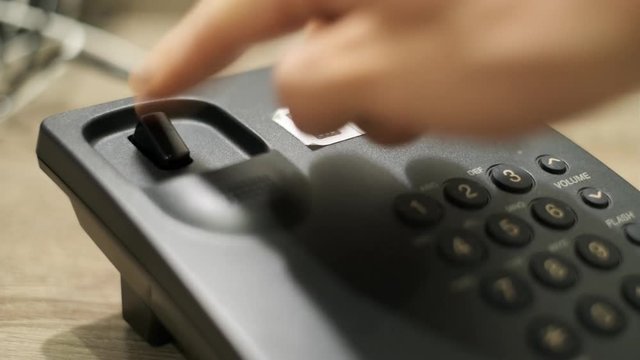 Man wants to make a wired phone call