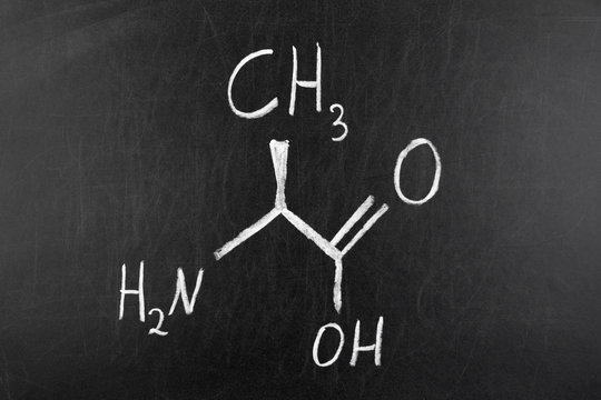 Alanine (L-alanine, Ala, A) amino acid molecule on blackboard