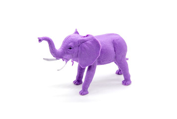 Purple plastic toy elephant on white background