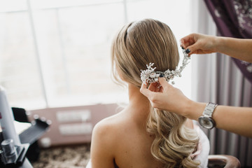 Elegant bride hairstyle. Bridal accessory, bridal hairstyle. Look from back