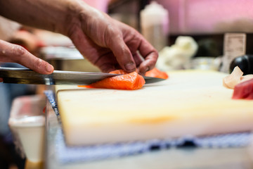 preparing and cooking sushi satshimi for japanese food