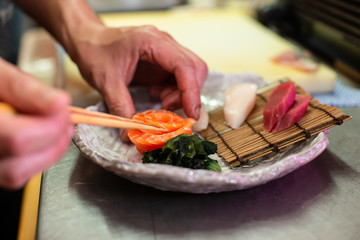 preparing and cooking sushi satshimi for japanese food