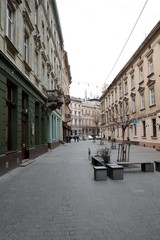 Obraz premium Narrow courtyards in the city, the old stone road. Street in the city of Lviv Ukraine 03.15.19