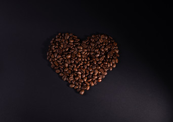 Heart-filled coffee beans with lower right lighting