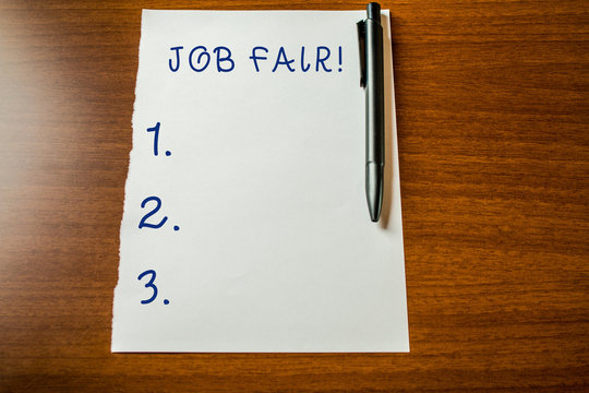 Handwriting text Job Fair. Conceptual photo event in which employers recruiters give information to employees Upper view blank stationary paper lying wooden table pen. Writing essay