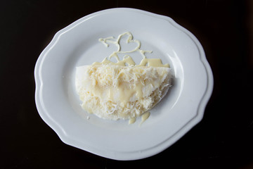Tapioca in a white dish with dark background