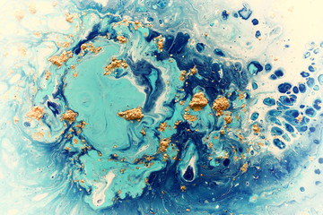 Abstract marbleized effect background. Blue creative colors. Beautiful paint with the addition of gold