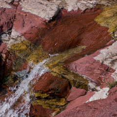 Water flowing through rocks, Red Rock Canyon Parkway, Waterton Lakes National Park, Alberta, Canada
