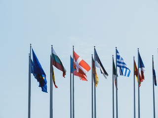 The Member States of the European Union French, Eu, Hungary, Estonia, Germany, Spain, Greece waving in calm weather with blue sky in background a day before European parliamentary elections in Europe