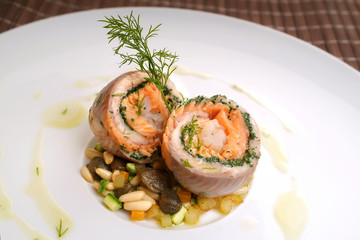 Italian food recipes, roulade of freshwater fish with capers and pine nuts.