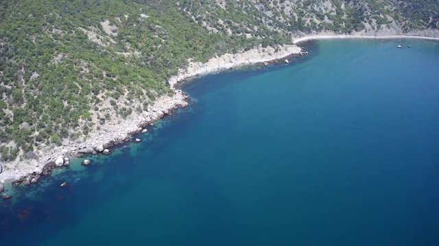 Aerial of the coast meets the Black Sea in blue shallow waters.