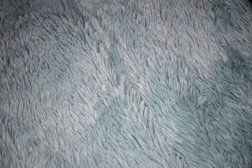 Woolen blanket forms an ocean of thin hairs of its structure.