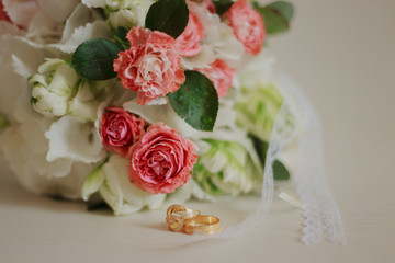 Beautiful modern wedding bouquet on a white table. Wedding attributes. No people