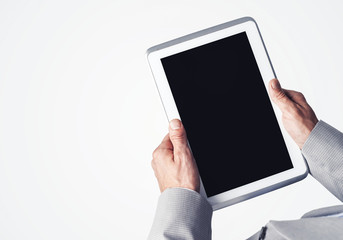 Hands of businessman holding tablet pc with black screen