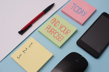 Writing note showing Find Your Purpose. Business concept for reason for something is done or for which still exists Note papers and stationary plus gadgets placed sideways above backdrop