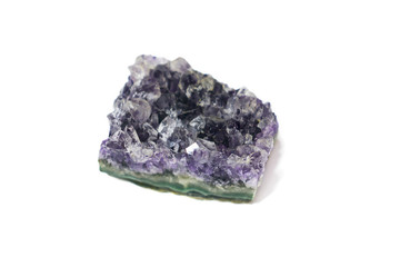 Natural Druse of purple amethyst crystal on a white background. Isolated