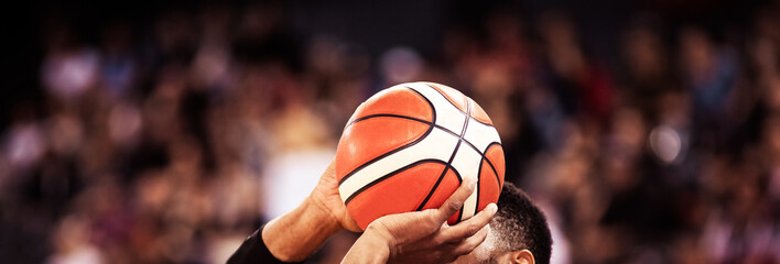 basketball player shooting three pointer