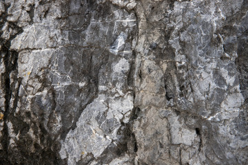Cracked stone texture background. Distressed natural surface. Eco design template. Volcanic rock cracked surface