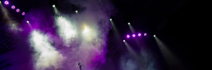 Obraz na płótnie Canvas Concert Stage Lighting in the Fog and Microphone. Web Banner.